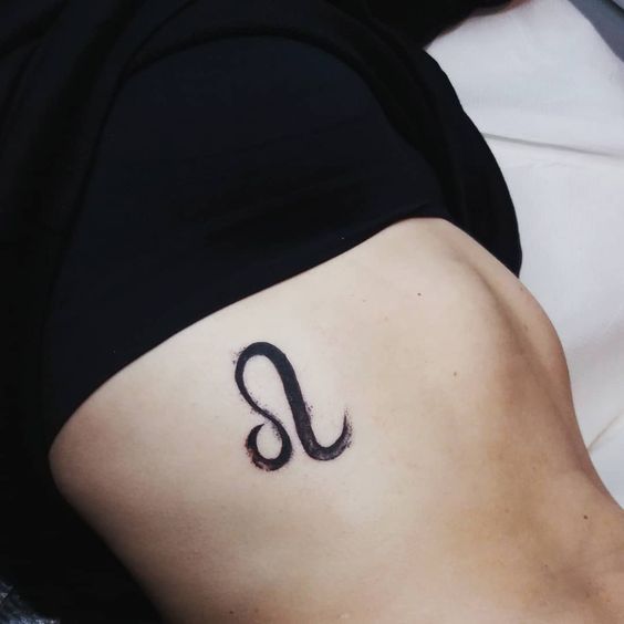 Leo small tattoo on rib girl
