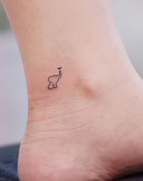 tiny elephant tattoo on foot