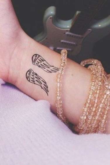 angel wings tattoo on wrist for womens