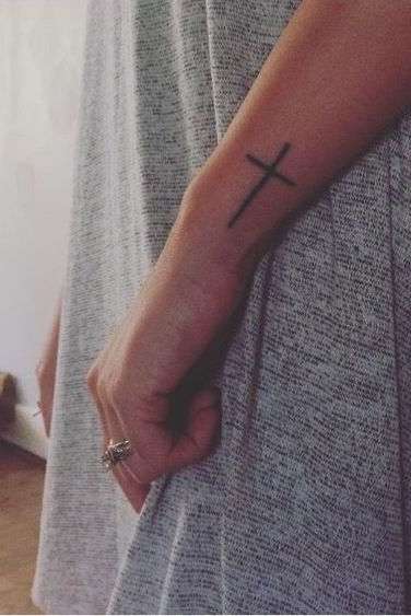 side cross tattoo on wrist