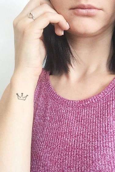 small crown tattoo on wrist
