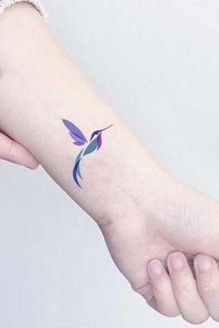 feather wrist tattoo for females