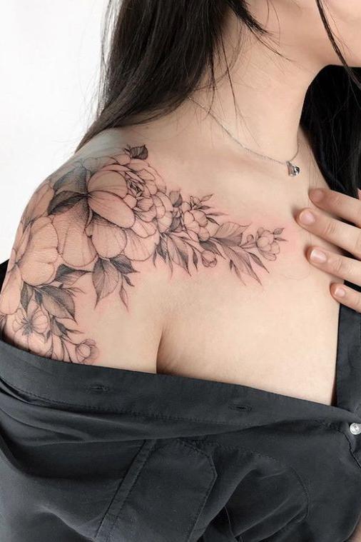 black floral shoulder cap tattoo
