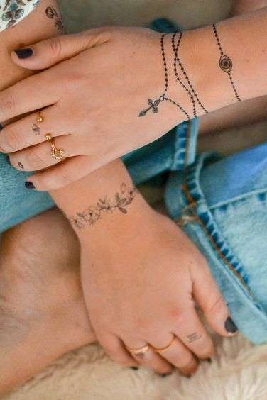 rosary tattoo on wrist for girls