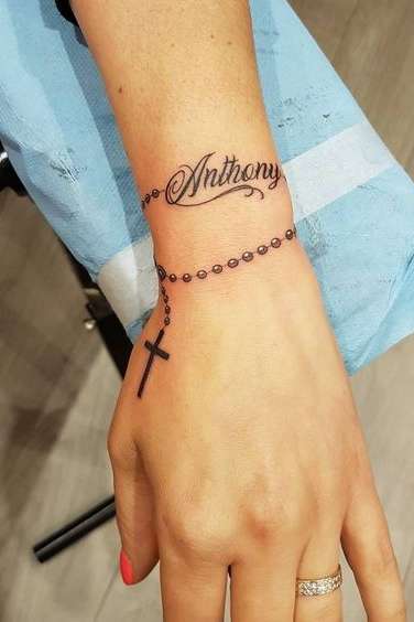 rosary tattoo on wrist for women