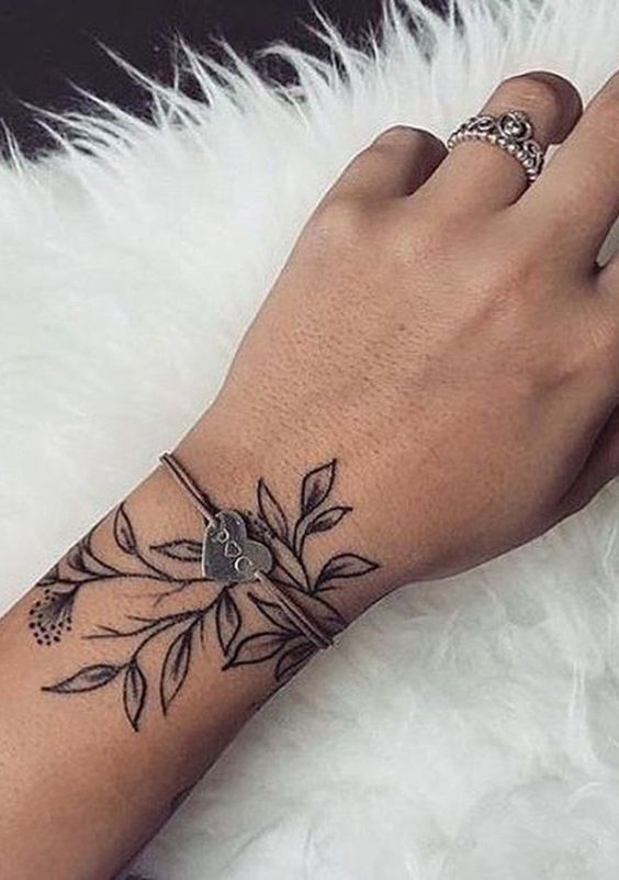rose tattoo on wrist for females