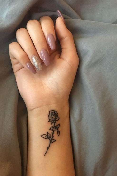 rose tattoo on wrist for women