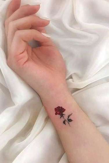 small rose tattoo on wrist for girls