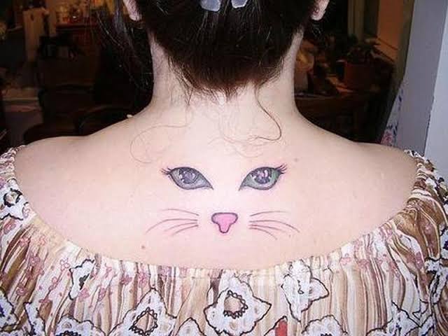Cat Eye Tattoo on back