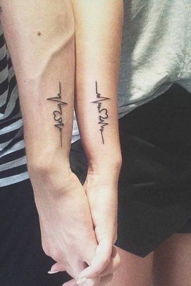 heart line couples matching tattoos