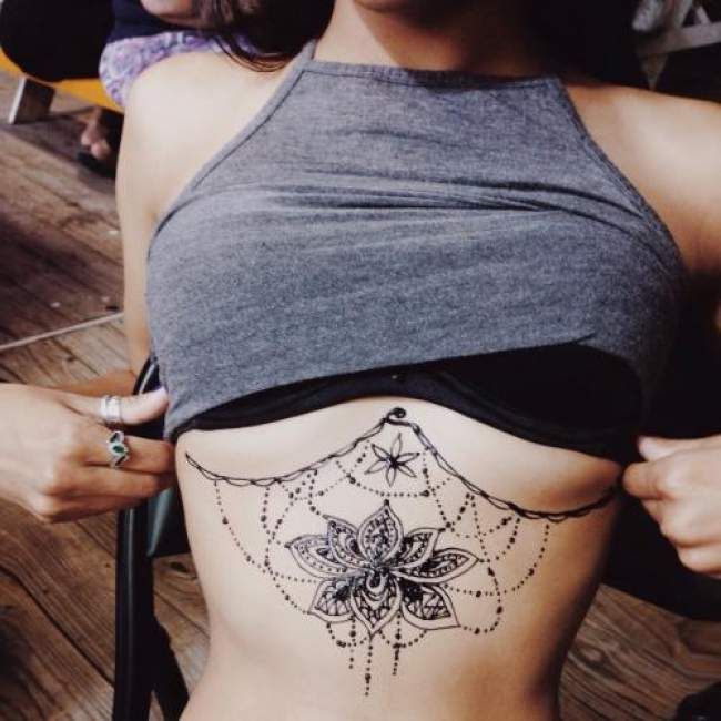 girl under chest tattoos 