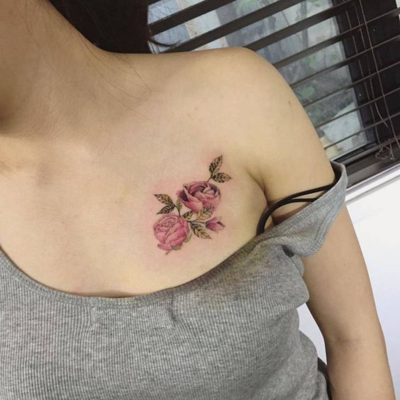 rose chest tattoo female
