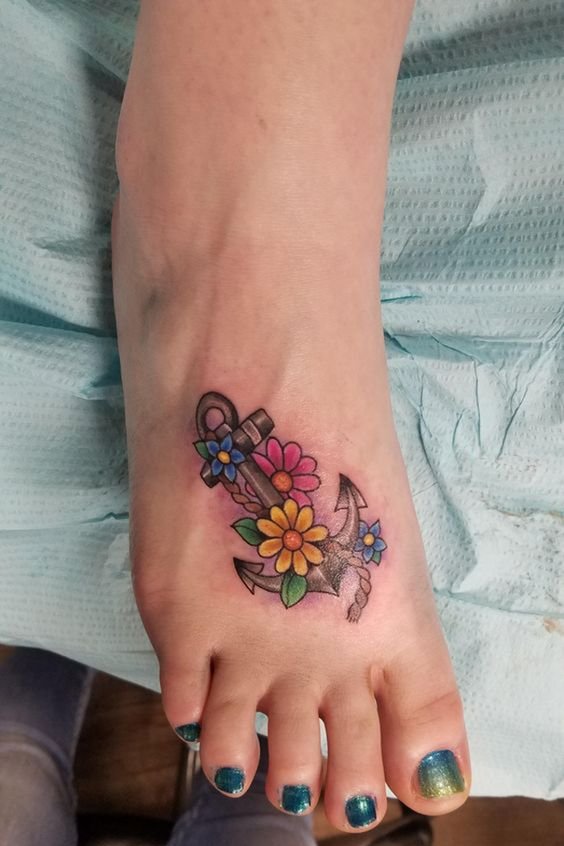 colorful anchor tattoo on foot