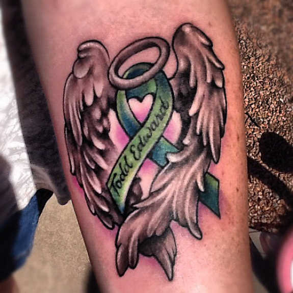 Cancer Ribbon + Wings Tattoo on Arm