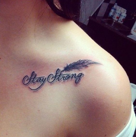 feather and text tattoo on shoulder