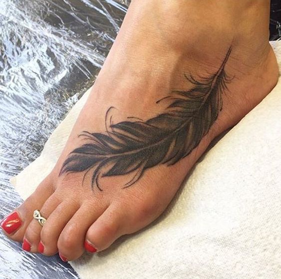 feather tattoo design on foot