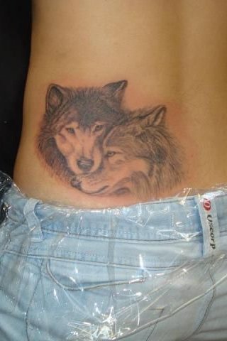 two wolf tattoo on back