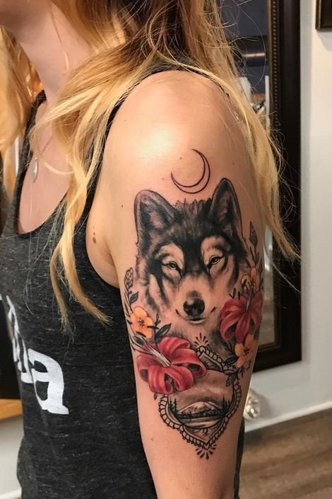 wolf + Moon + flowers tattoo on upper arm