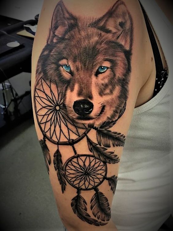15dream catcher and wolf tattoo on upper arm