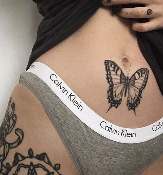 butterfly stomach tattoo