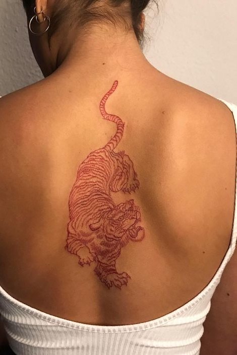 red tiger tattoo on middle back