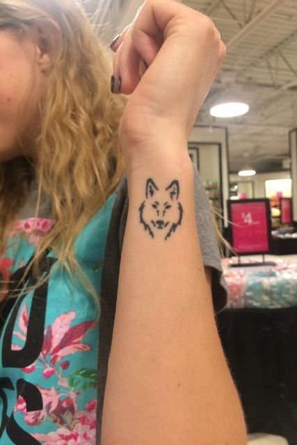 wrist wolf tattoo