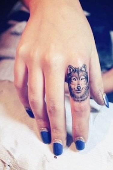 finger small wolf tattoo