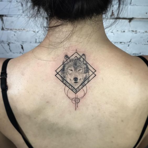 wolf tattoo in shape on Back
