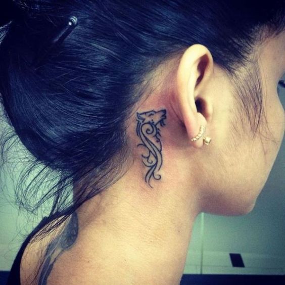 wolf tattoo behind ear