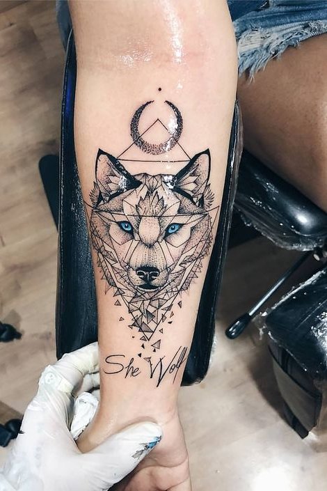 wolf tattoo on wrist