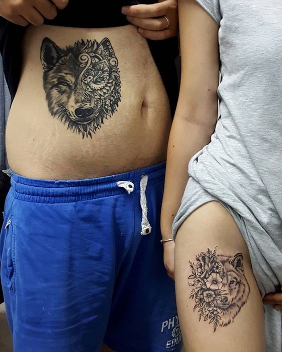 flower + wolf tattoo on thigh