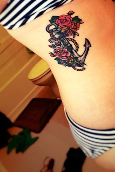 colorful anchor tattoo on rib