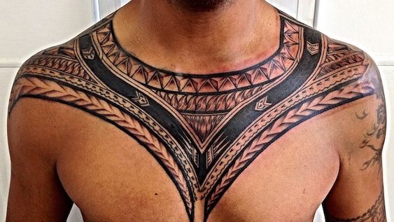 Tribal tattoo on chest for men