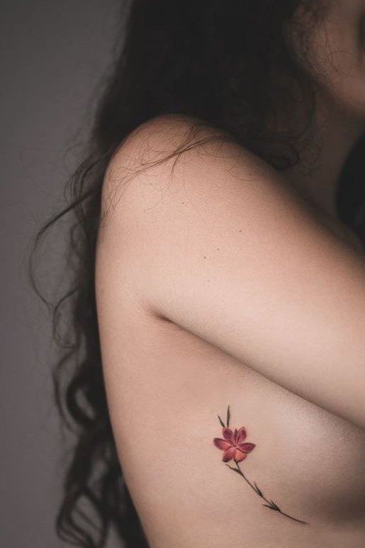 Rib flower tattoo