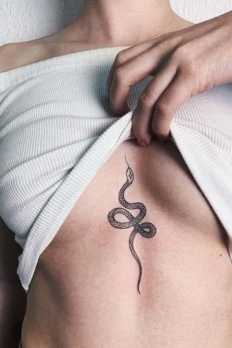 Snake tattoo on stomach