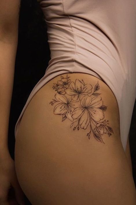 flower tattoo on groin for females