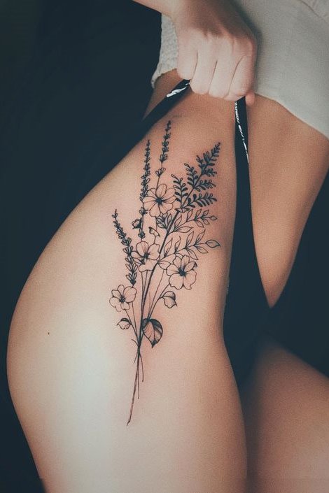 Thigh tattoo flower for females