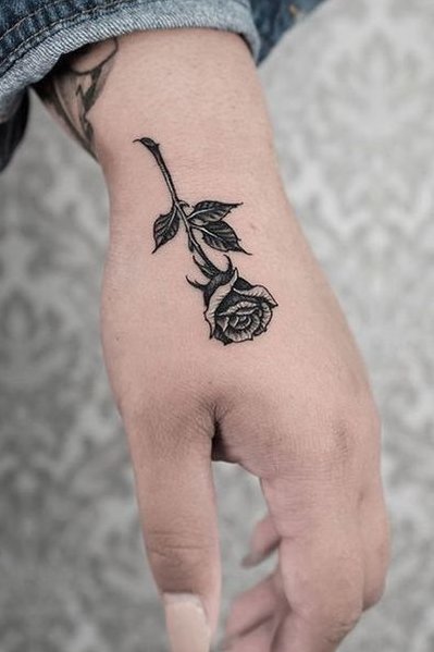 Rose flower tattoo on hand