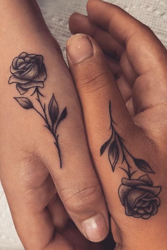 Rose flower tattoo on finger