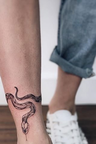 Snake tattoo on leg