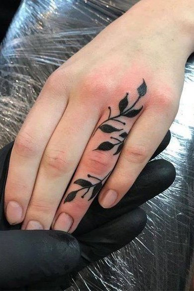 flower tattoo on finger