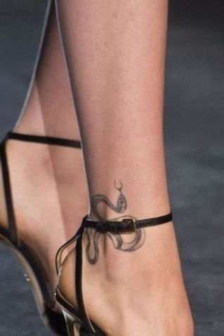 Snake tattoo on leg