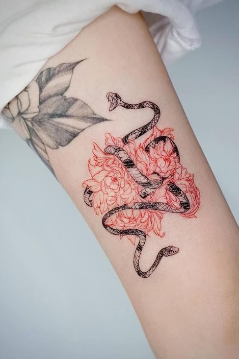 Flower + snake tattoo