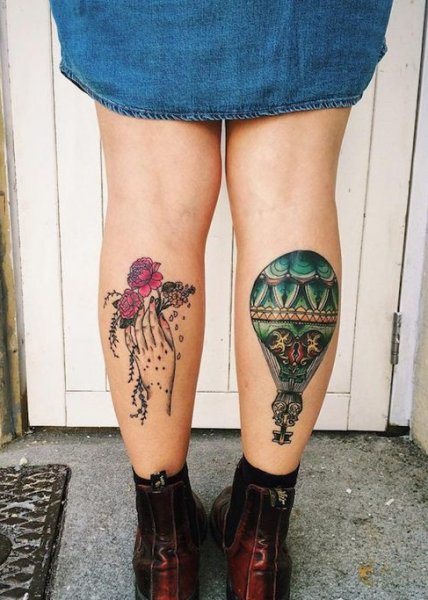 colorful flower tattoo on calf
