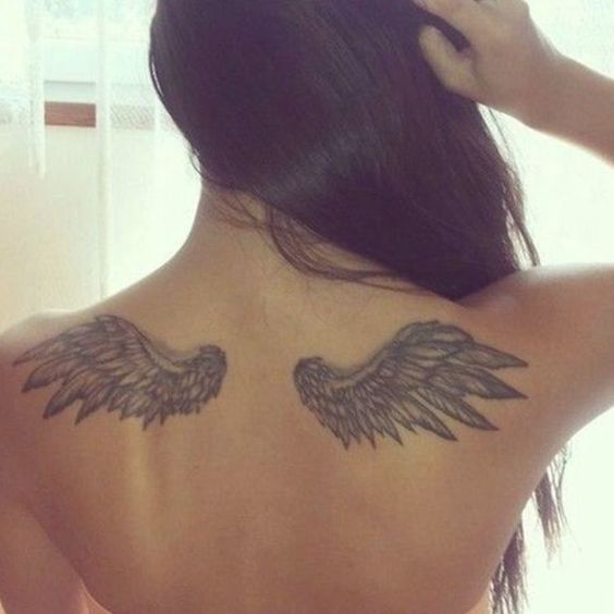 Angel wings tattoo on back for women