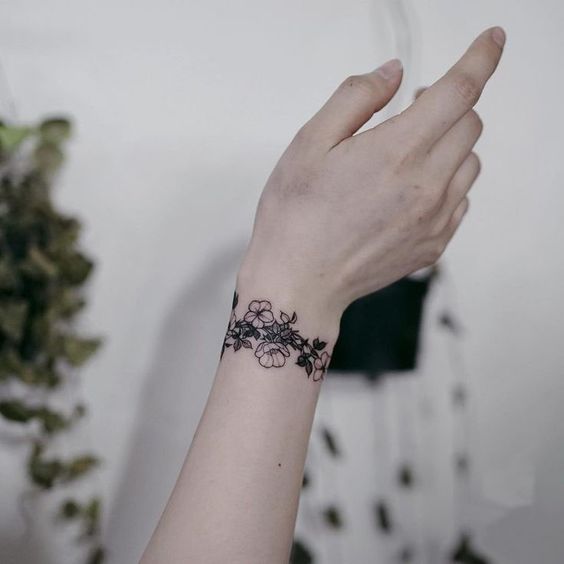 Bracelet tattoos on wrist
