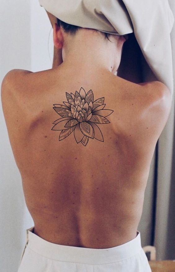 Lotus flower mandala tattoo on back