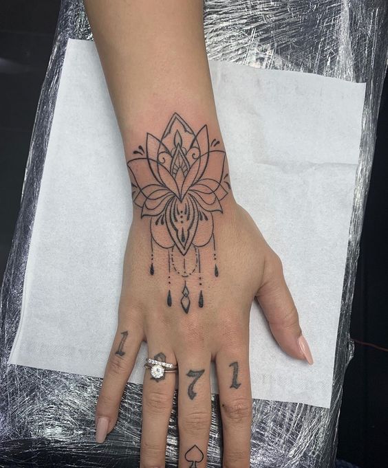 Lotus flower mandala tattoo on wrist