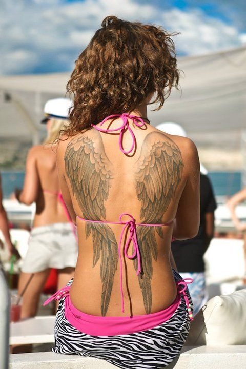 Angel wings tattoo on back for women