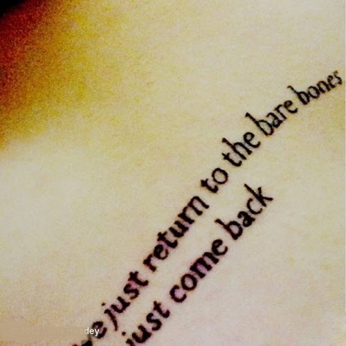 Quote Tattoo On Her Left Side